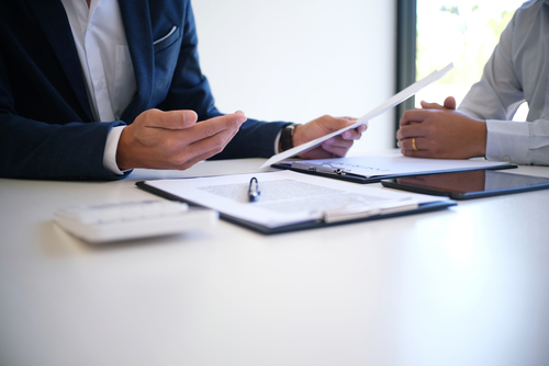 Business person checking policies